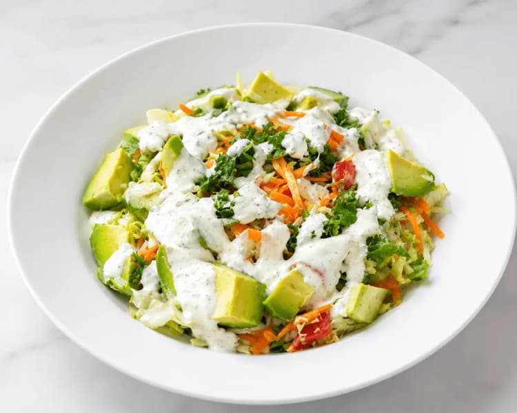Fresh avocado and kale salad with creamy dressing